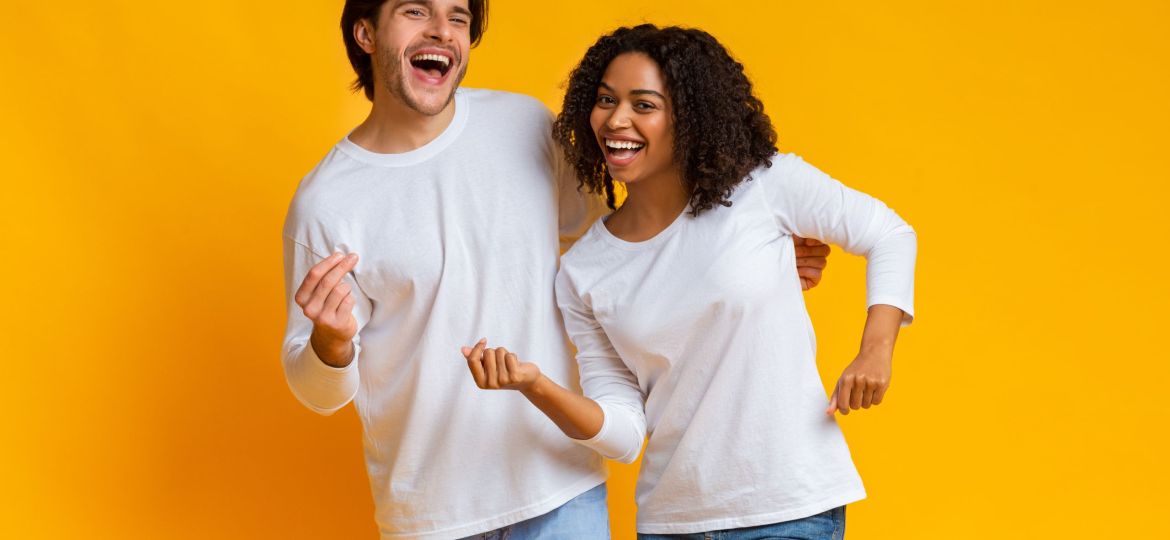 Joyful Interracial Couple Having Fun, Dancing And Fooling Together In Studio